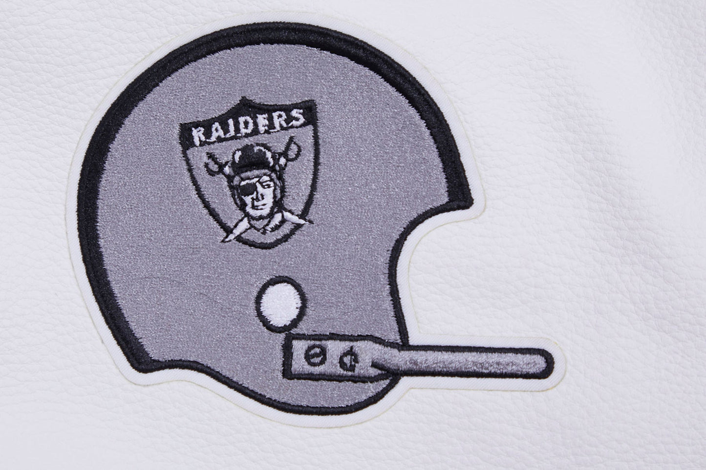 Oakland Raiders NFL jacket in black with wool body, genuine leather sleeves, strip-ribbed collar, and logo embroidery helmet. on the back